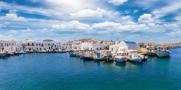 Panoramic view of townscape by sea against sky