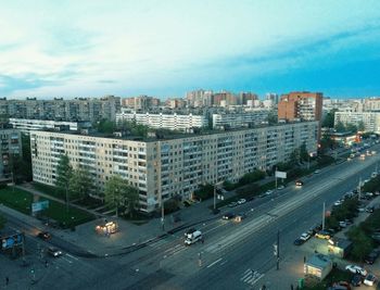 Cityscape against cloudy sky