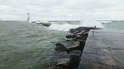 Scenic view of sea against cloudy sky