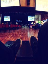 Low section of people walking on railroad station platform