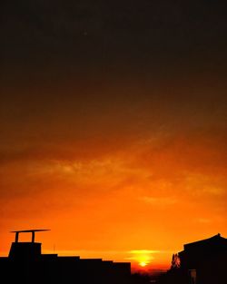 Silhouette of buildings at sunset
