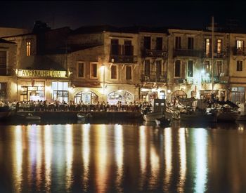 Reflection of illuminated buildings in water at night