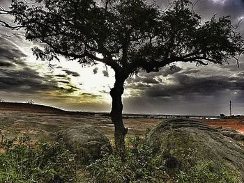 Scenic view of sea against cloudy sky