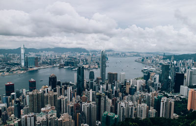 High angle view of cityscape against cloudy sky