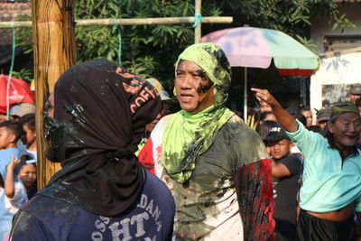 Rear view of people enjoying in park