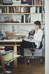 Side view of architect working on product at home office