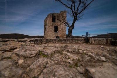 Low angle view of old building against sky