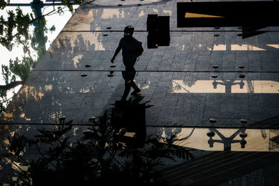 Man walking by building in city