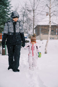 Full length of man standing on snow