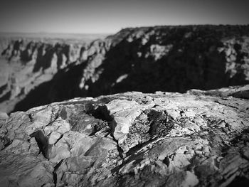 Close-up of rock against sky