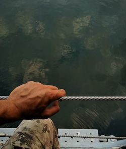 Midsection of person holding lake