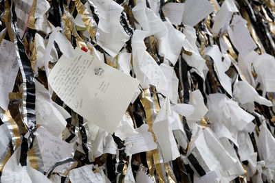 Full frame shot of papers hanging outdoors