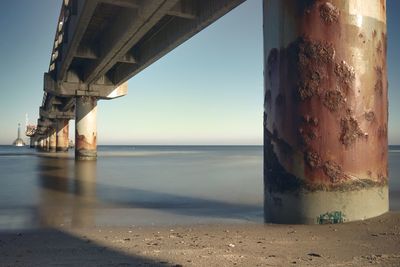 View of bridge over sea against clear sky