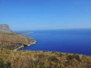 Scenic view of sea against clear blue sky