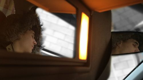 Close-up of woman sitting in bus