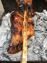 Close-up of meat on barbecue grill