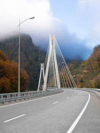 Bridge over highway against sky