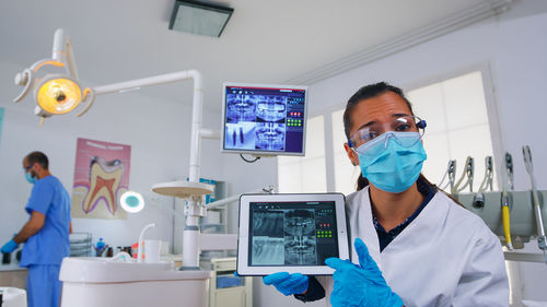 Portrait of young woman working in laboratory