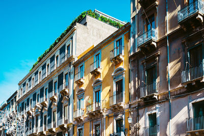 Low angle view of building against blue sky