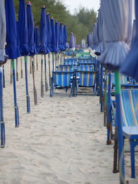 Empty chairs on beach