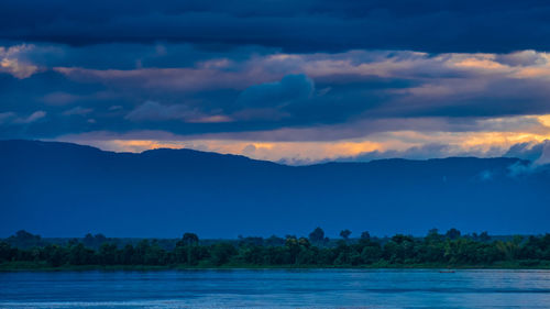 Scenic view of lake against sky during sunset