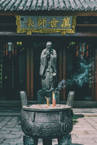 Statue of buddha outside building