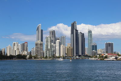 City skyline against cloudy sky