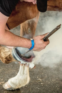 Low section of man working at farm