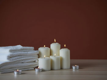 Close-up of candles on table