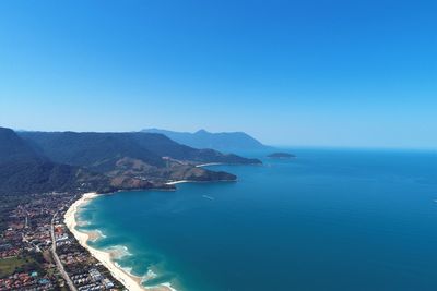 High angle view of bay against clear blue sky