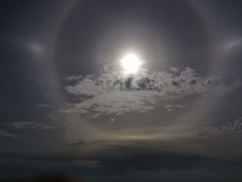 Low angle view of illuminated moon against sky