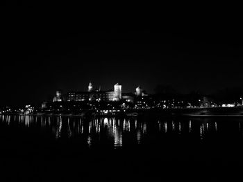 Reflection of illuminated buildings in water at night