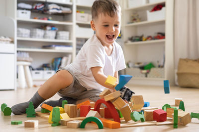 Boy playing with toy blocks