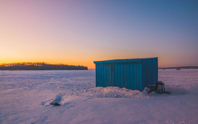 Hut against sky during sunset