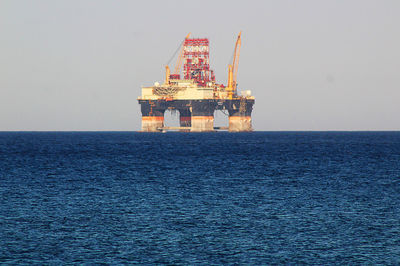 Scenic view of sea against sky. oil gas platform. 