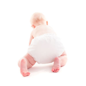 Midsection of baby against white background