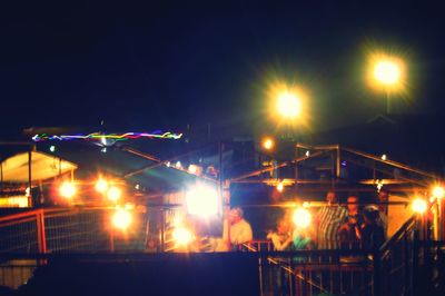 Illuminated suspension bridge at night