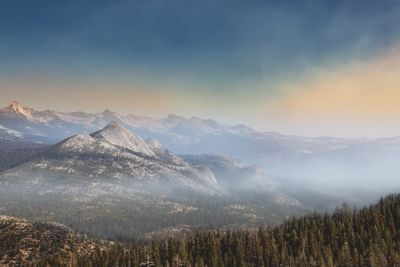 Scenic view of snowcapped mountains during sunset