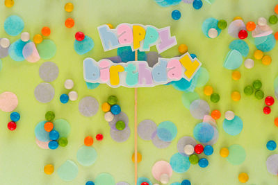 High angle view of multi colored candies on table