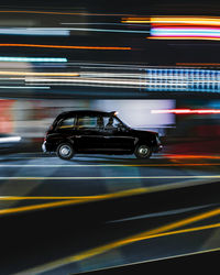 Blurred motion of car on road at night