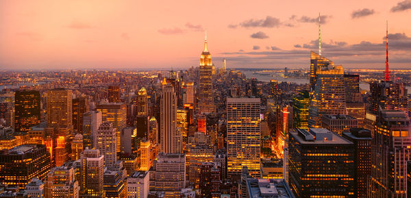 Aerial view of city at sunset