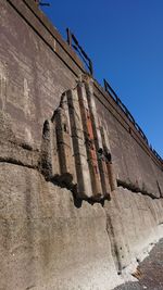 Low angle view of built structure against clear blue sky