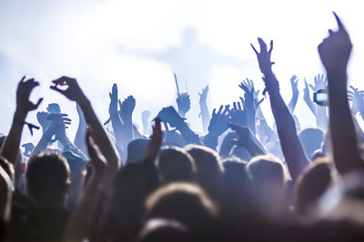 Crowd at music concert in hall