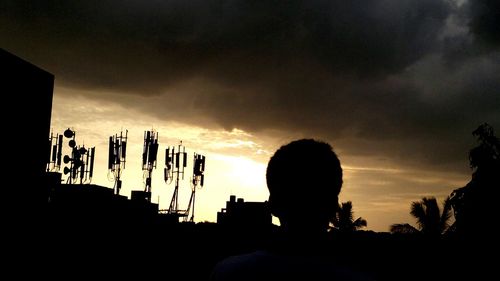 Silhouette of people at sunset