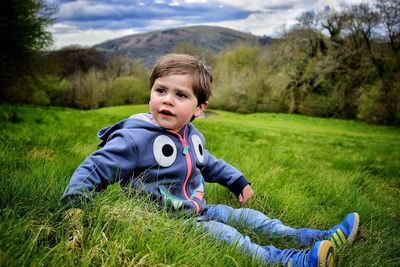 Portrait of smiling boy in grass