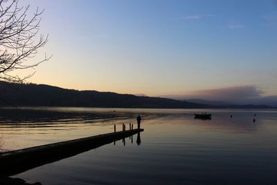 Scenic view of sea against clear sky during sunset