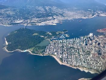 Aerial view of sea and buildings in city