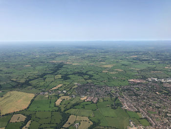 Aerial view of agricultural field against sky