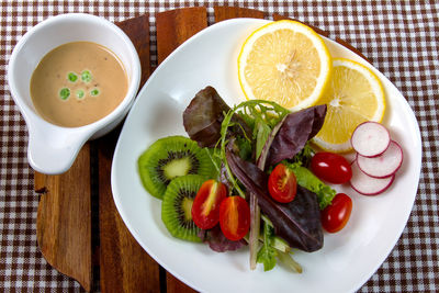 High angle view of fruits in plate on table