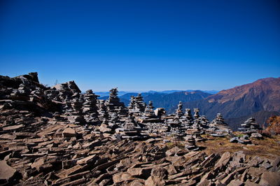 Scenic view of mountains against clear blue sky